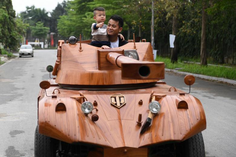 vietnamese-dad-spends-thousands-converting-van-into-wooden-tank-for-son