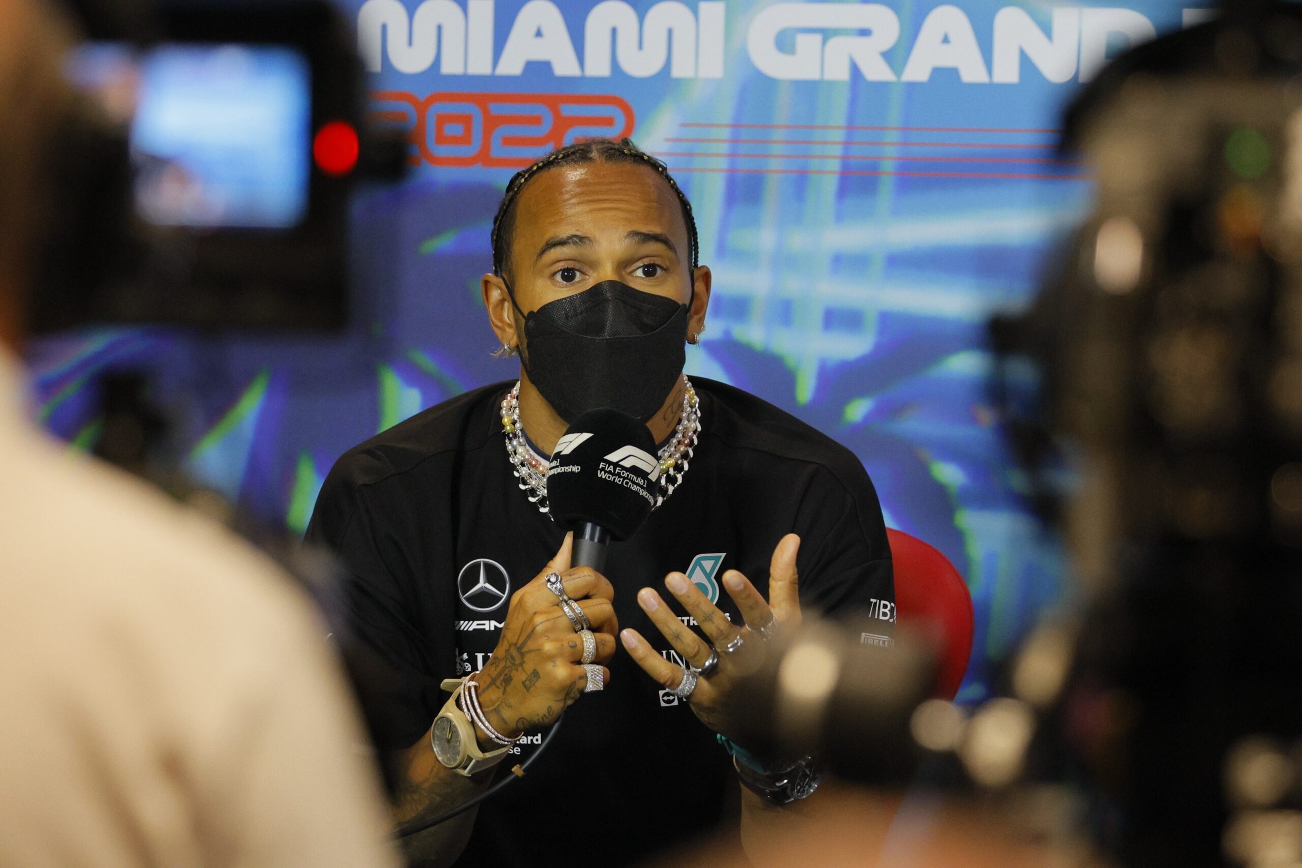 lewis-hamilton-gears-up-for-the-miami-grand-prix-wearing-three-watches,-eight-rings,-and-four-necklaces